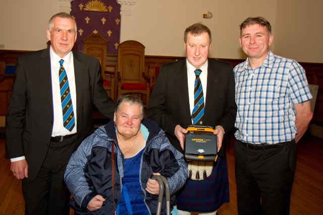 Marion & John Sandilands presenting a Defibrillator to the Lodge 2017